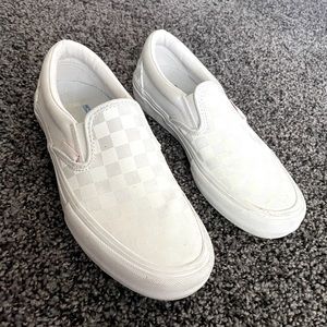 white, checkered, reflective vans, lightly worn